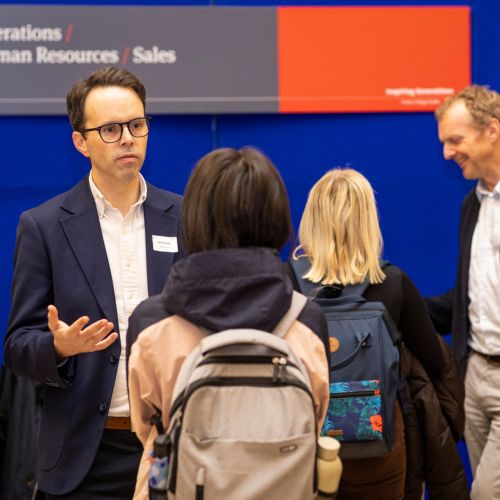 students attending a mentoring event speaking to experts on human resources, sales and other organisational and business skills.